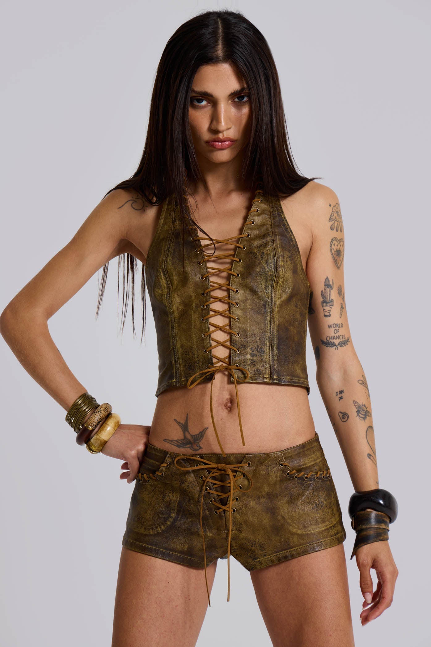 Vaca Whipstitch Faux Leather Mini Shorts in Brown