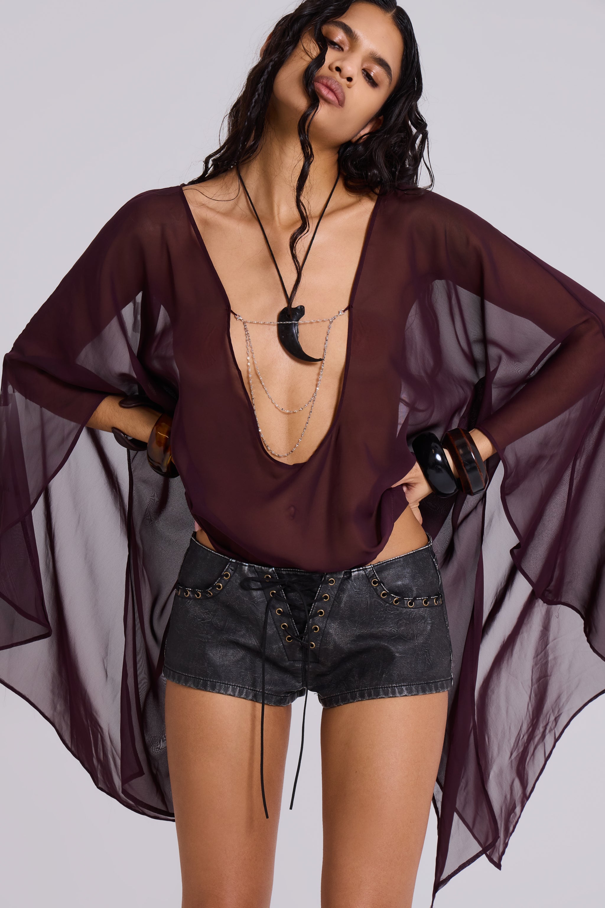 Vaca Whipstitch Faux Leather Mini Shorts in Black